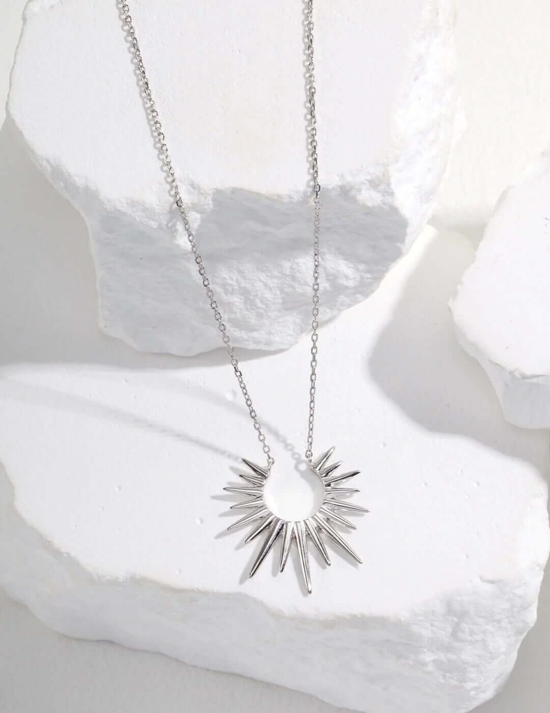 Eternal Light: Luminous Starburst Pendant Necklace